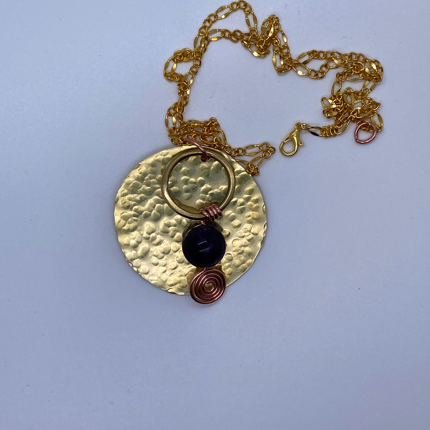 Round full square brass decorated with brass circle, wire and amethyst.