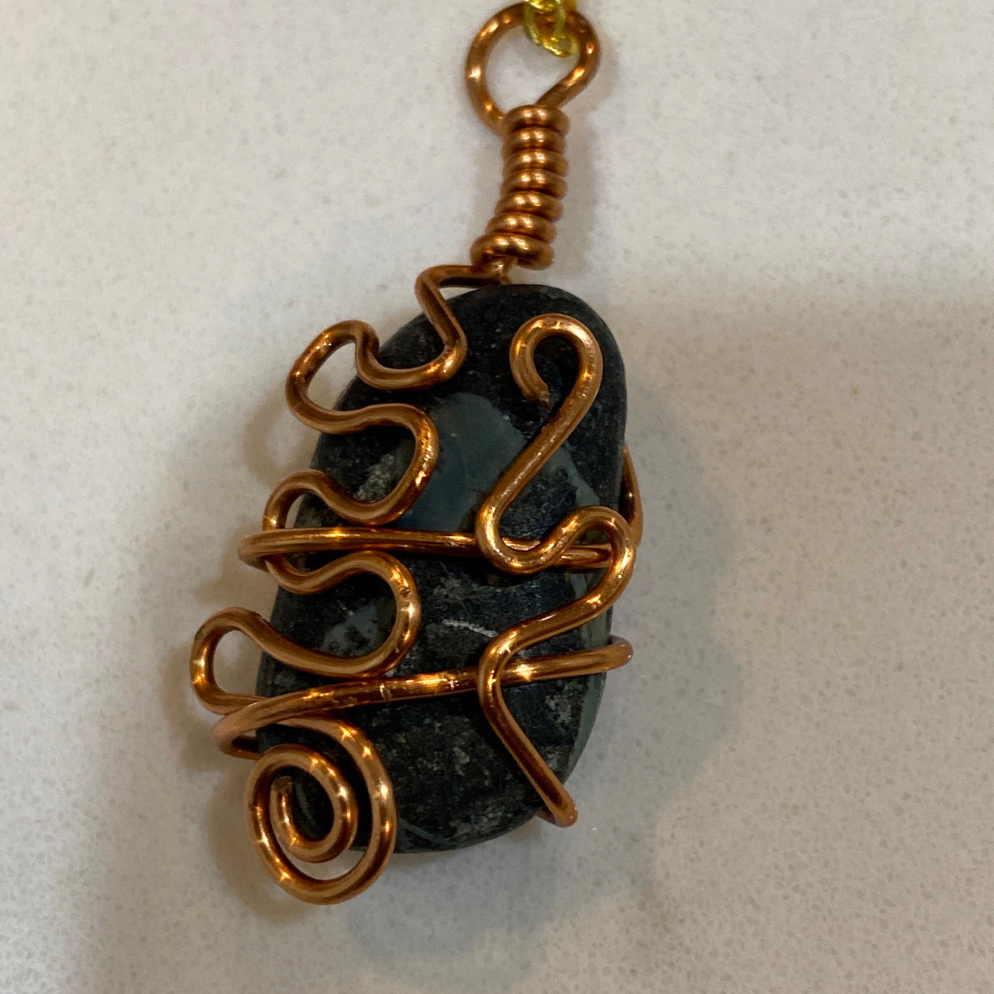 Black stone and wire. Small pendant for this shiny gorgeous stone.