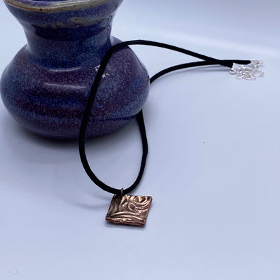 Handmade bronze square on 2mm suede black cord