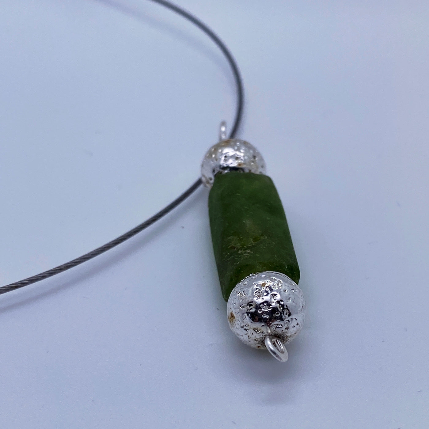 Silver necklace and lava stone silver plated pearls and green glass pendant