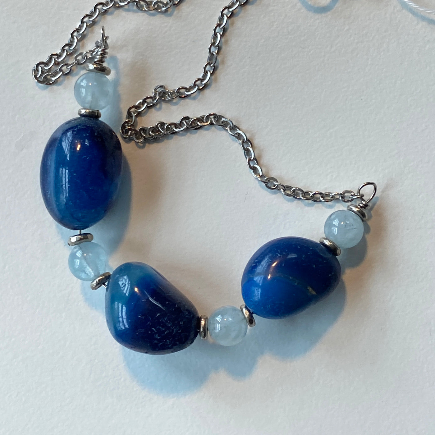 Blue sapphires, acquamarine and silver chain necklace