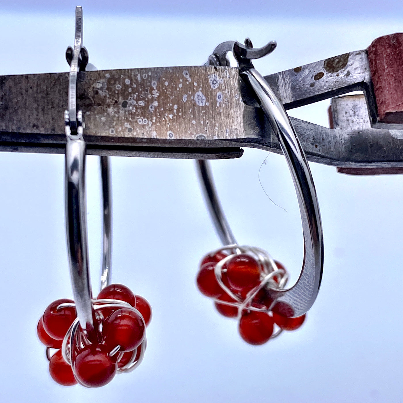 Round sterling silver earring with carnelian