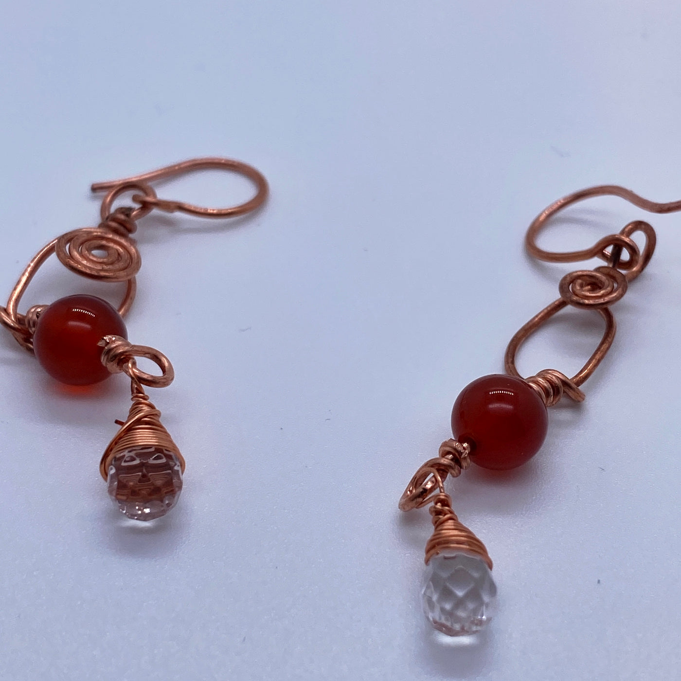 Copper wired earrings with white quartz wrapped briolette and carnelian