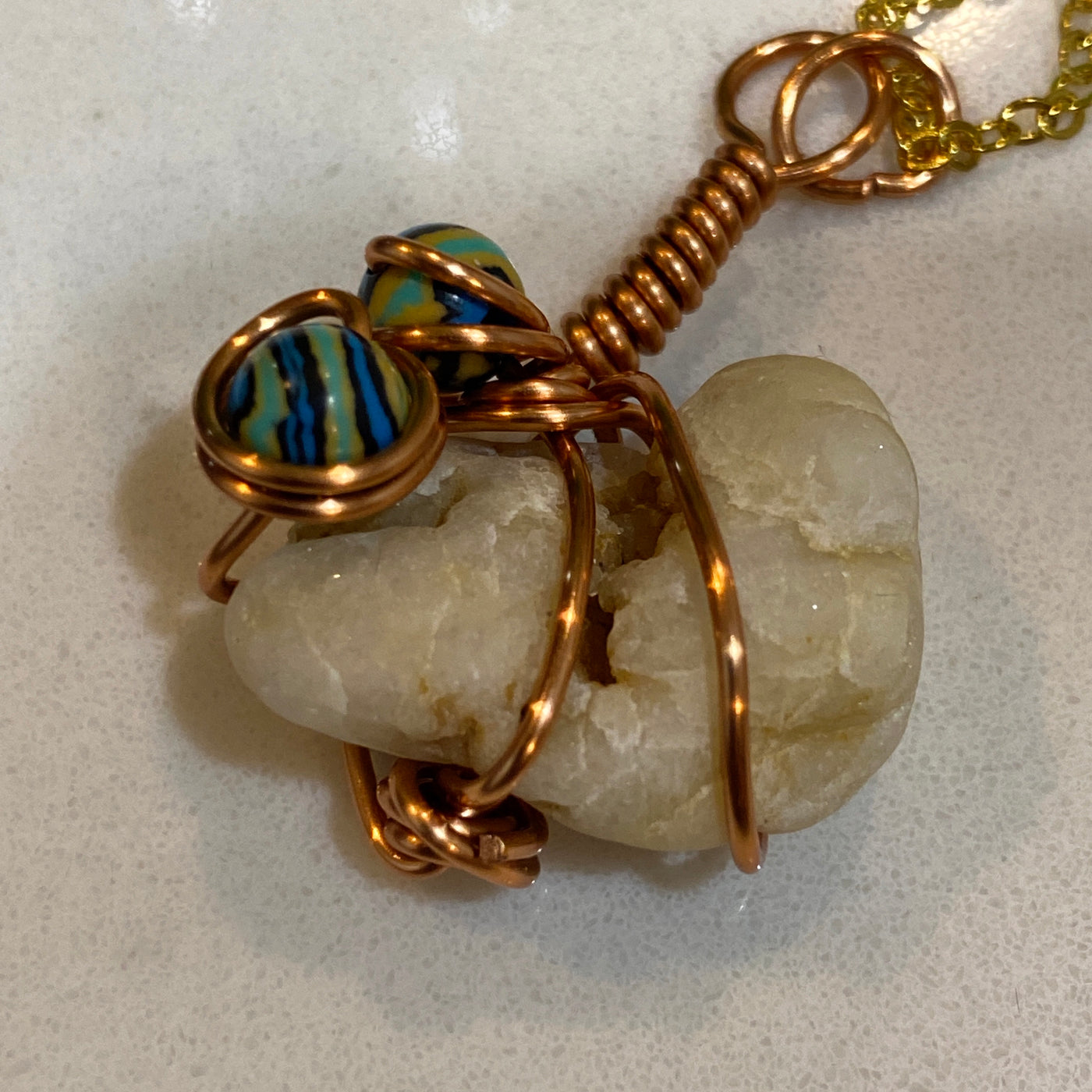 White natural stone, blue malachite and wire. Small pendant.