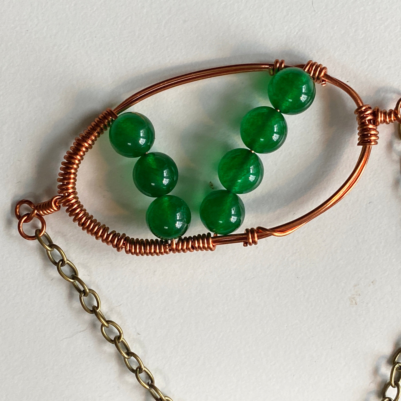 Green calcedony and wire pendant.
