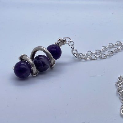 Amethyst in silver cage