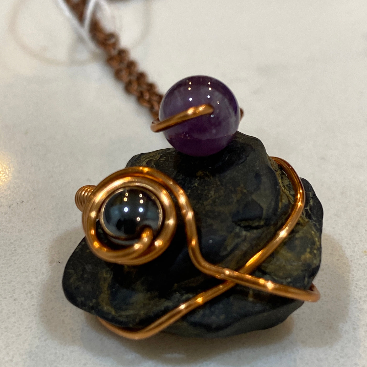 Black natural stone, amethyst, black stone and wire on chain. Small pendant.
