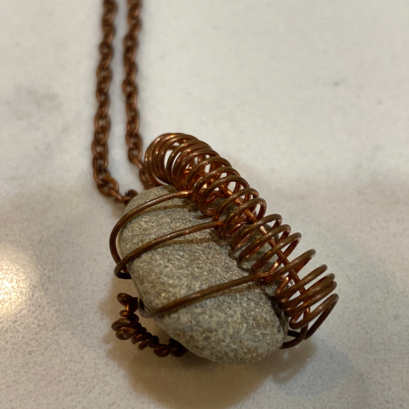 Grey natural stone on wire. Small pendant.