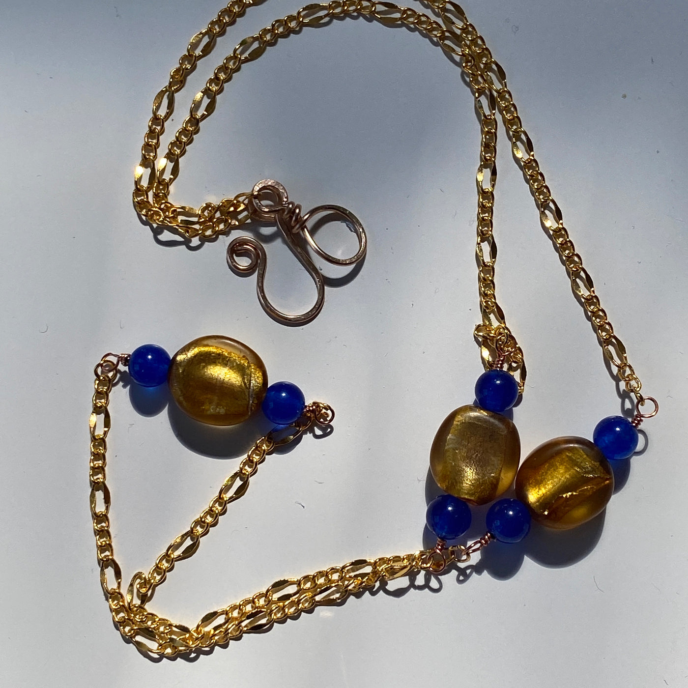 Golden glass beads and blue calchedony necklace.