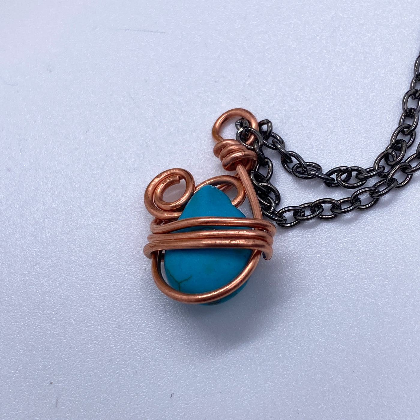 Wrapping wire on turquoise briolette