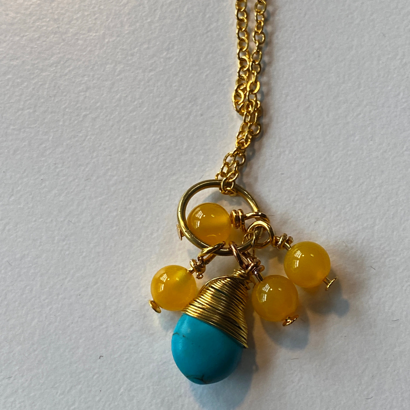 Turquoise briolette, yellow agate pendant. Shake and Move collection