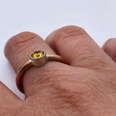 Brass and silver ring with simil golden topaz 5 mm.