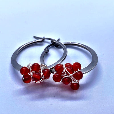 Round sterling silver earring with carnelian