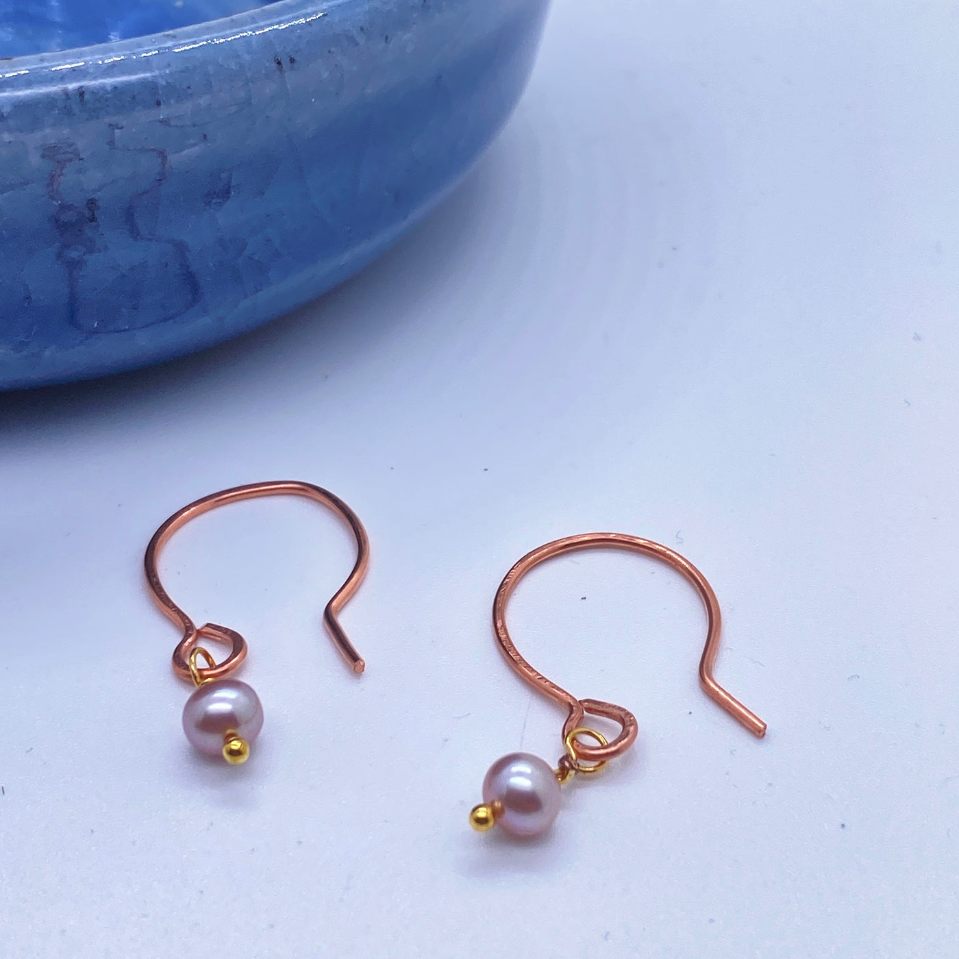 Small circles lavander pearls earrings.
