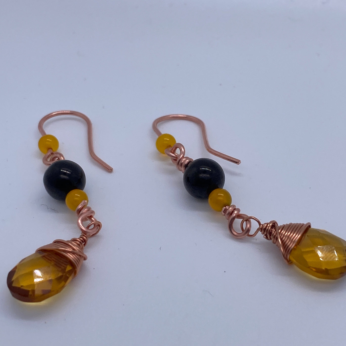 Earrings on wire with yellow agate, citrine briolette and black beads. These earrings are approximately 6 cm long.