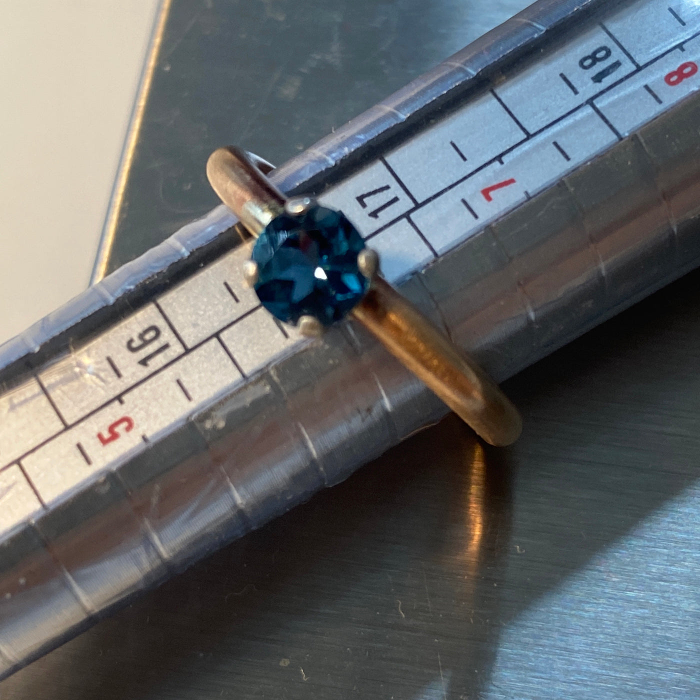 London blue topaz 6 mm set in silver on a brass ring US size 8  