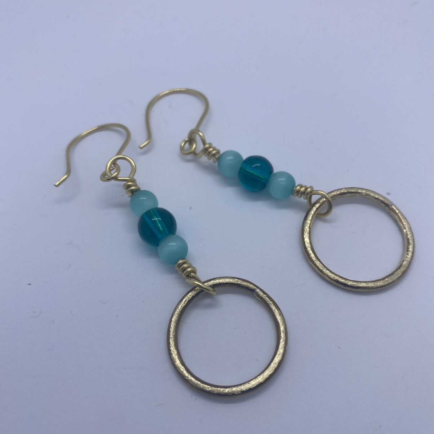 Handmade brass circles with ocean blue round glass 8 mm and 6 mm celeste blue cat eye earrings