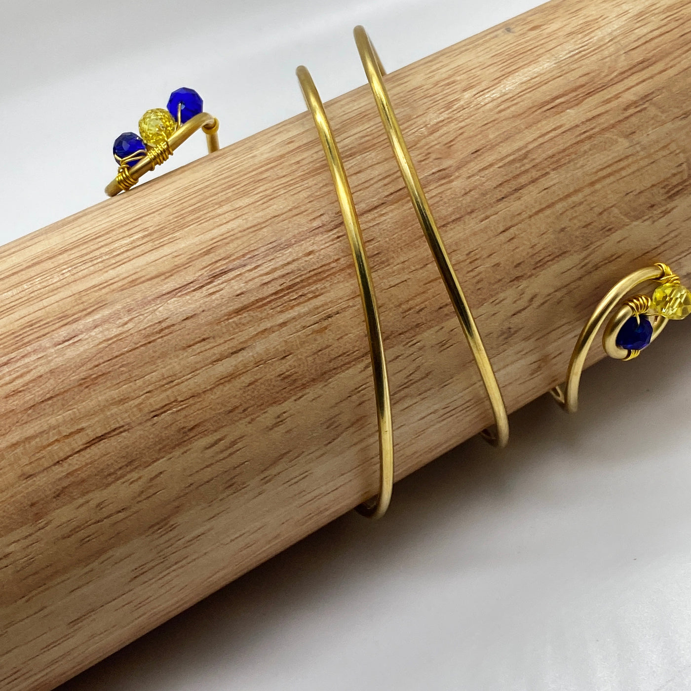 Long spiral brass bracelet with blue crystal rondelles