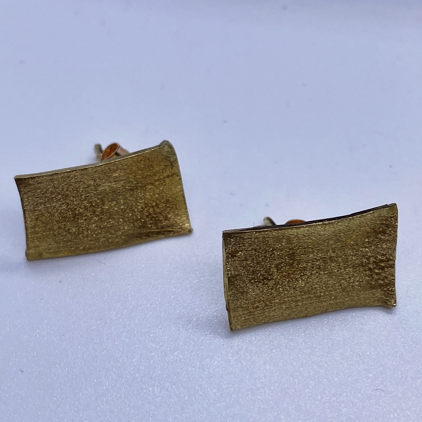 Rectangular yellow brass studs 2x1 cm texturized