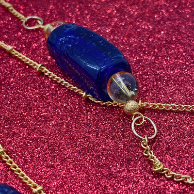 Dark blue glass tubes and citrine brass necklace
