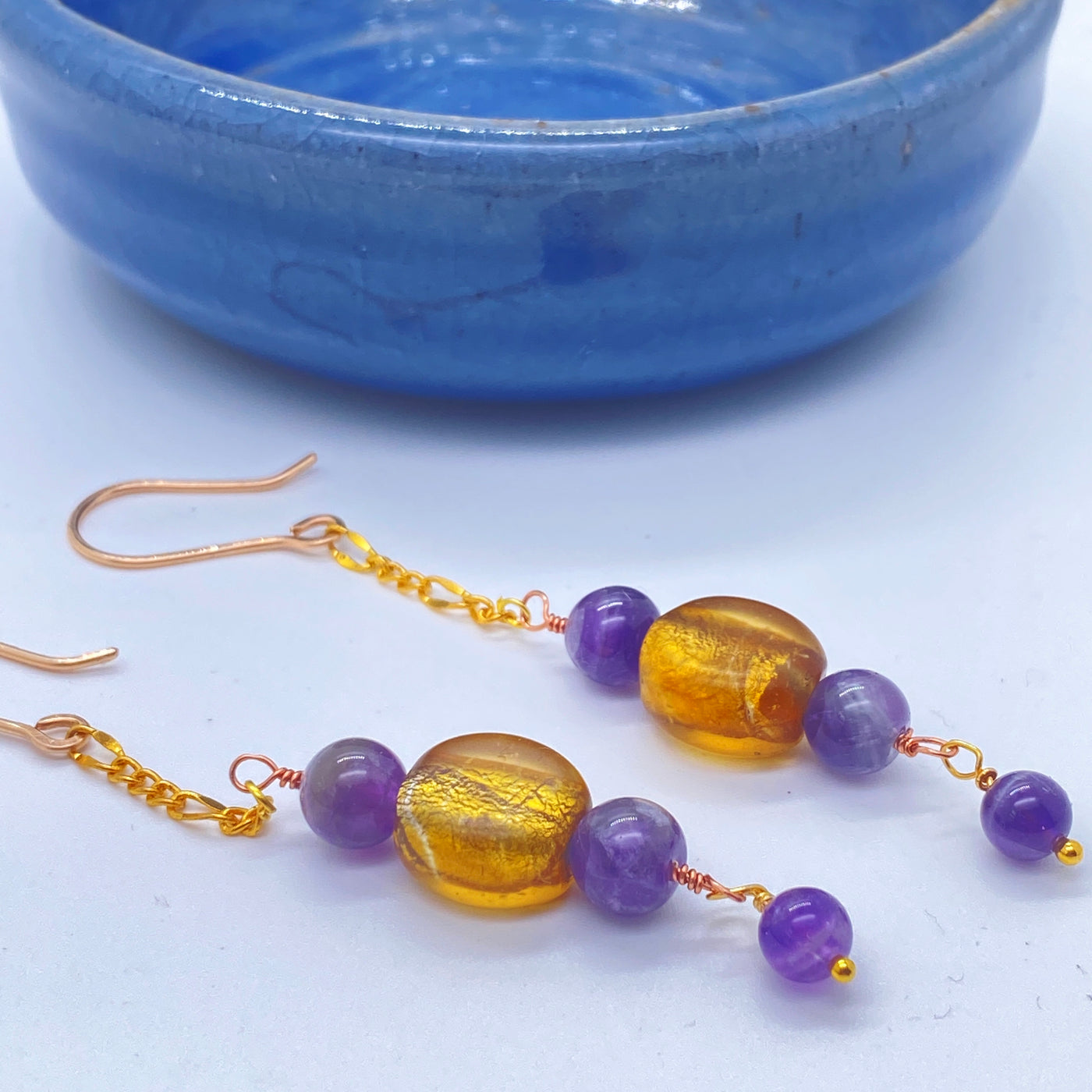 Golden glass beads and amethysts long earrings. 