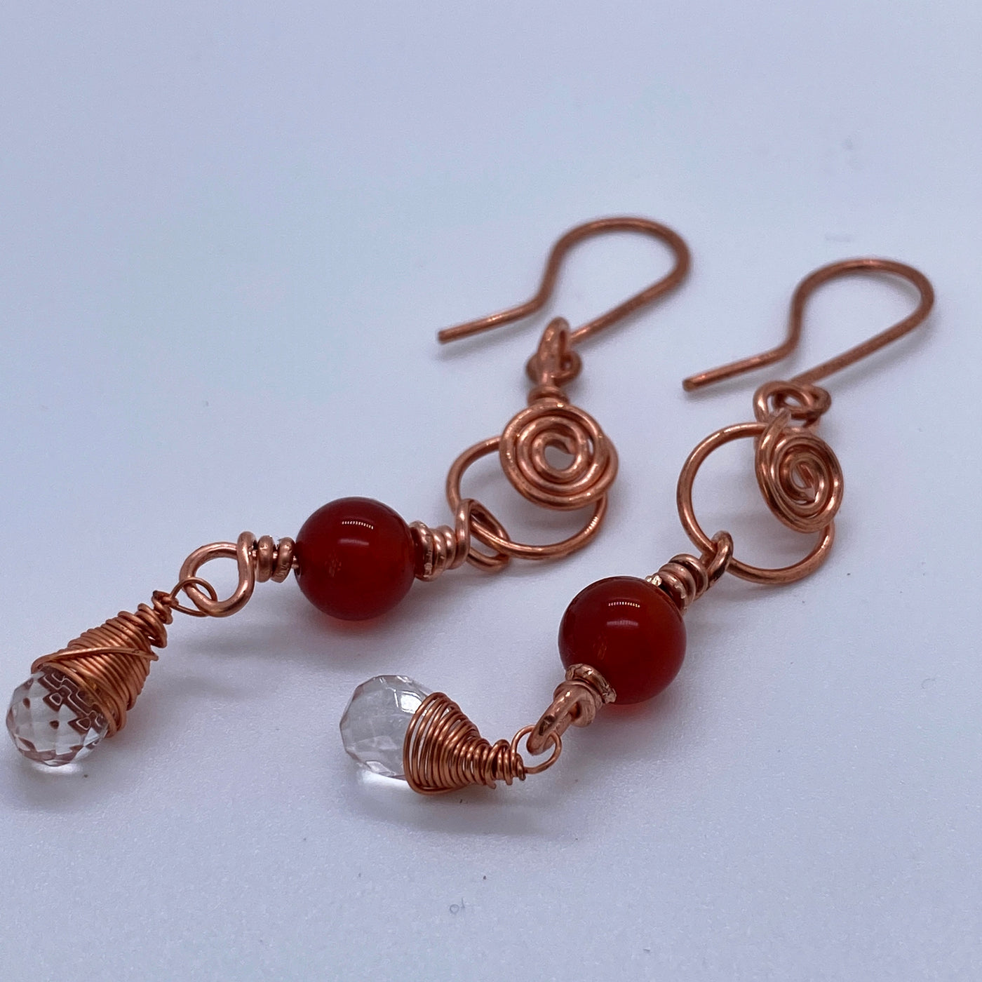 7 cm long earrings in wire and red agate with quartz briolette