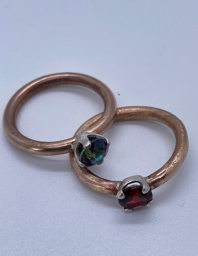 Garnet ring. This ring is made of brass and silver and features a gorgeous 6 mm round garnet. Size N
