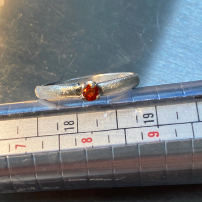 Silver and orange- ring size US 8 in silver and 3 mm orange cubic zirconia 
