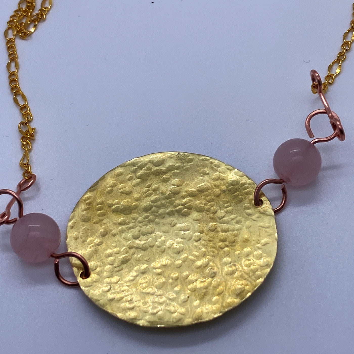 Rose quartz and brass central round pendant