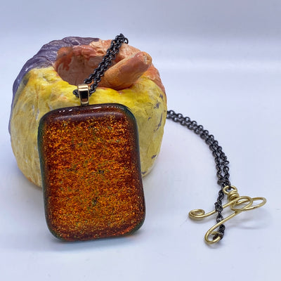 Orange glittery glass pendant