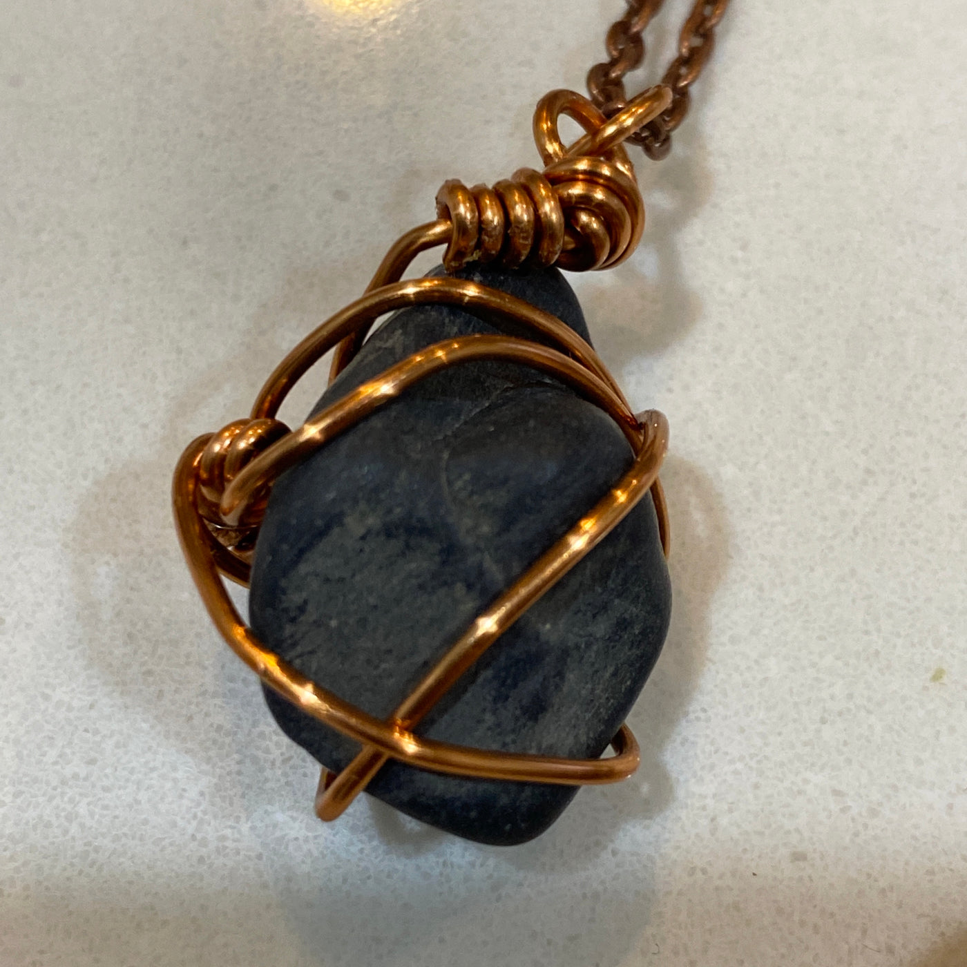 Black natural stone and wire on chain. Small stone pendant.