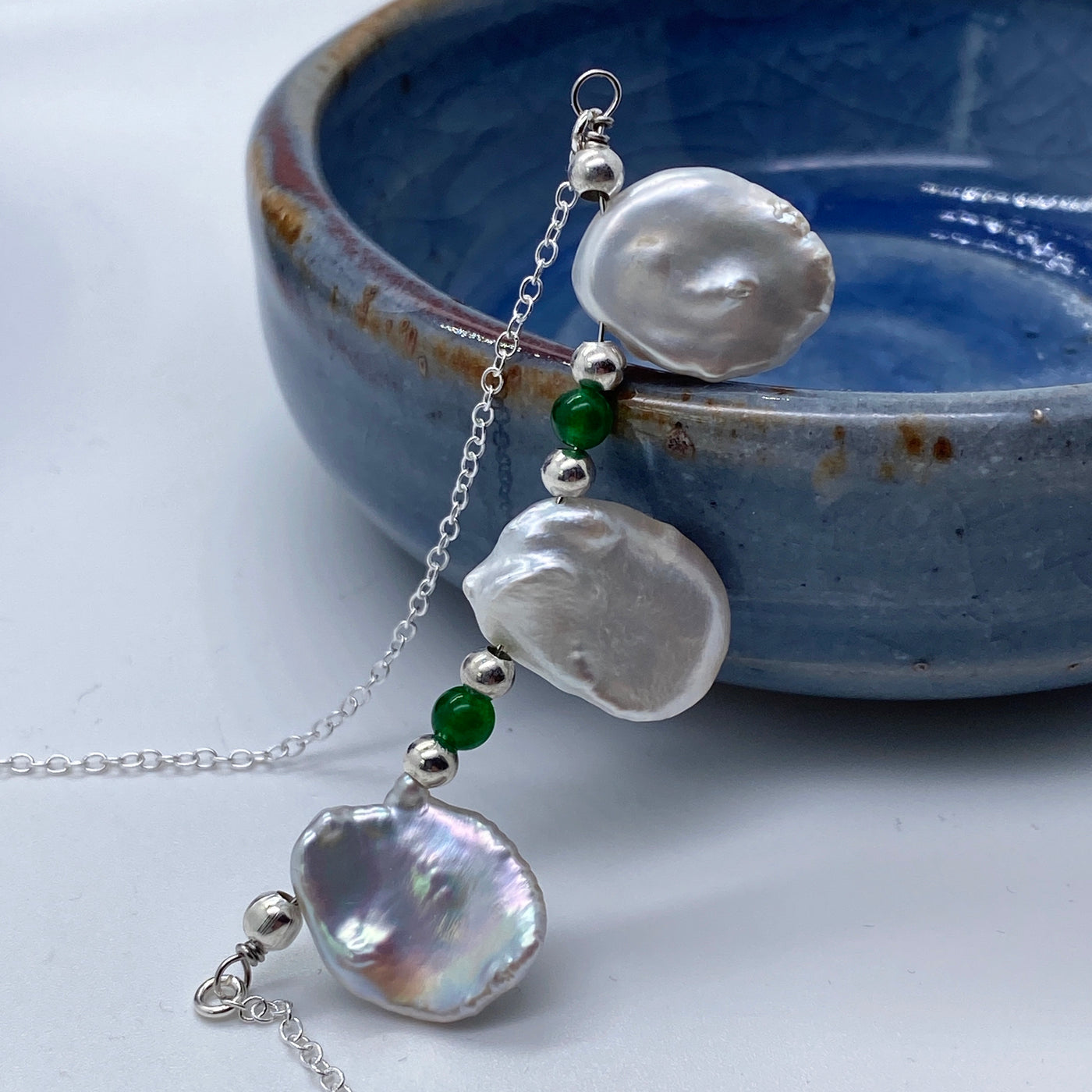 Baroque and green calchedony necklace 1. Baroque flat freshwater pearls and green calchedony on silver chain.