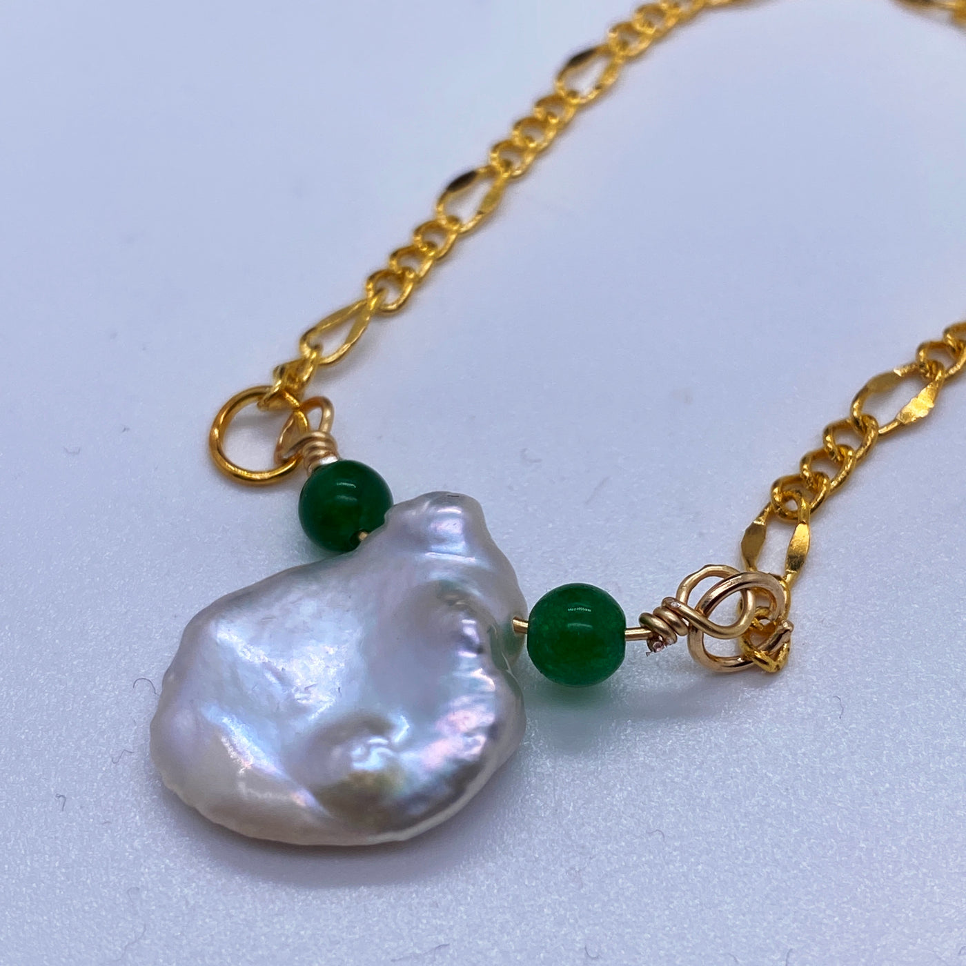 Baroque and green calchedony necklace 2. Baroque flat freshwater pearls and green calchedony on  chain. 