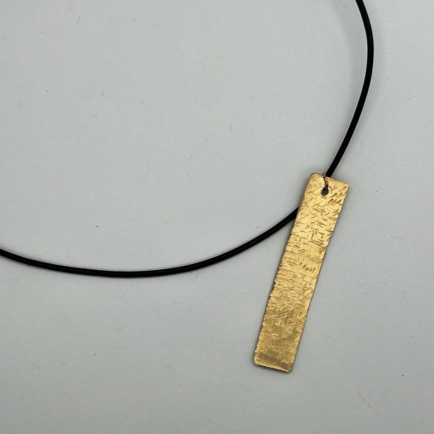 Brass hammered rectangle 6.2 x 0.9 pendant