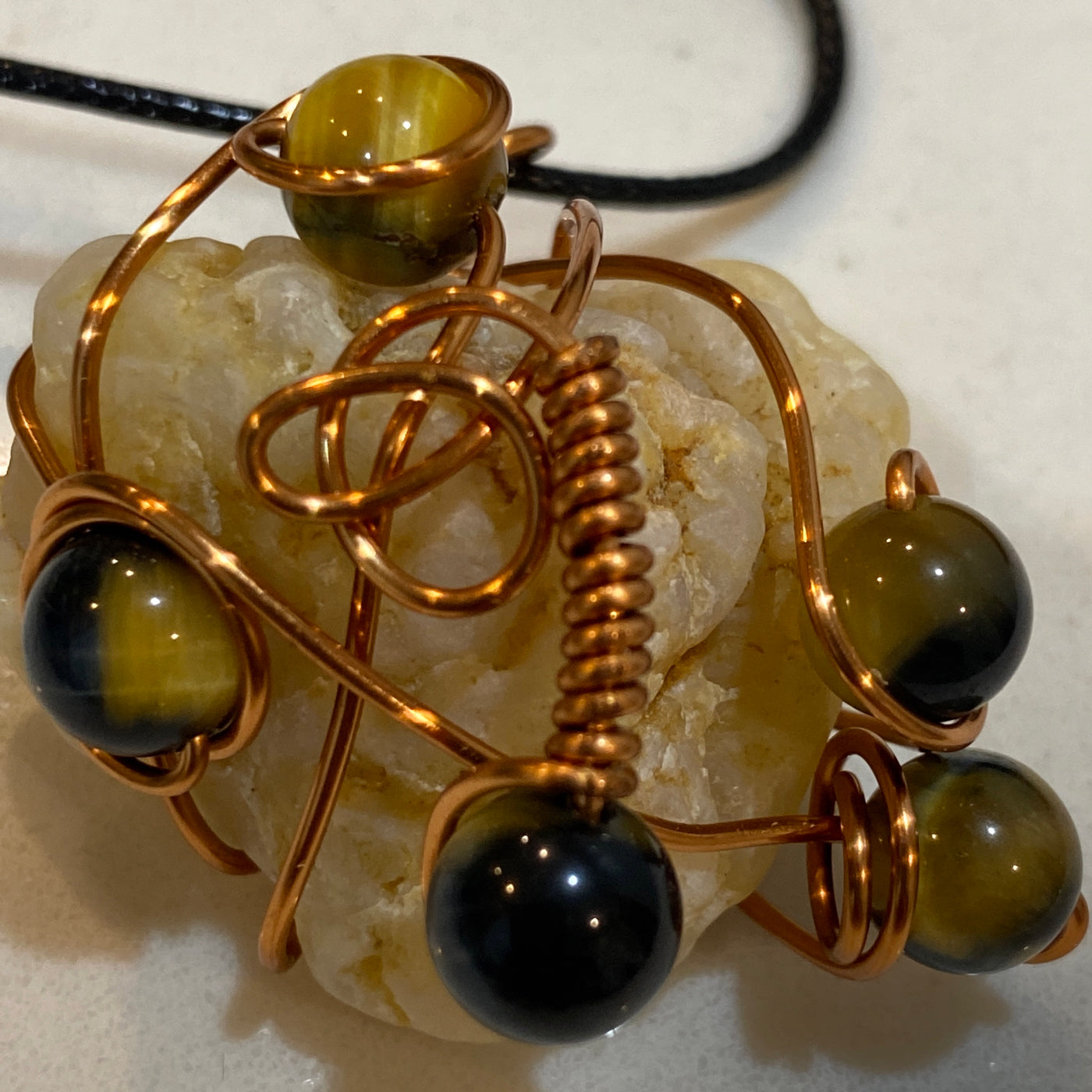 White natural stone, tiger eye and wire big pendant.