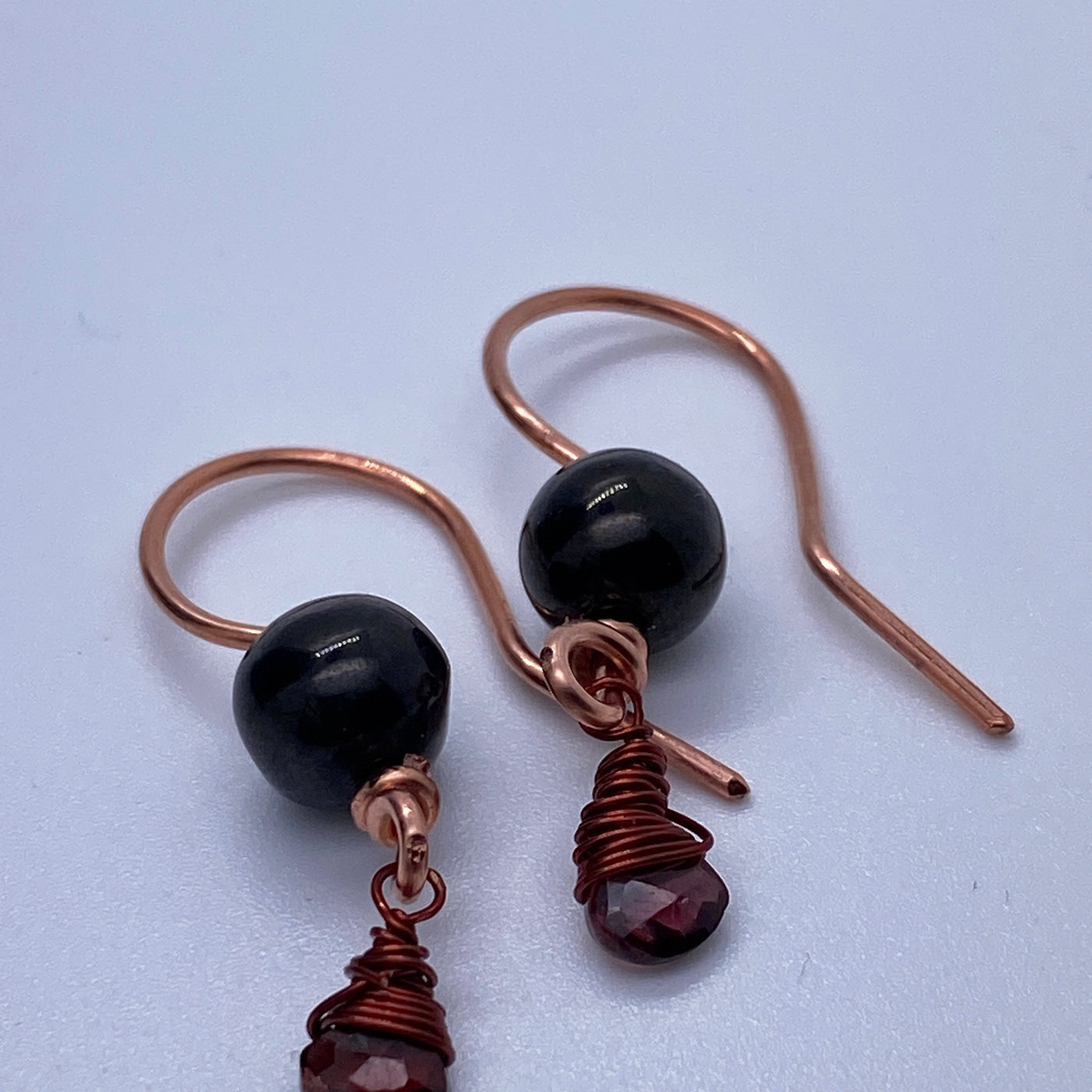 Garnet briolette, silver and black round pearl earrings